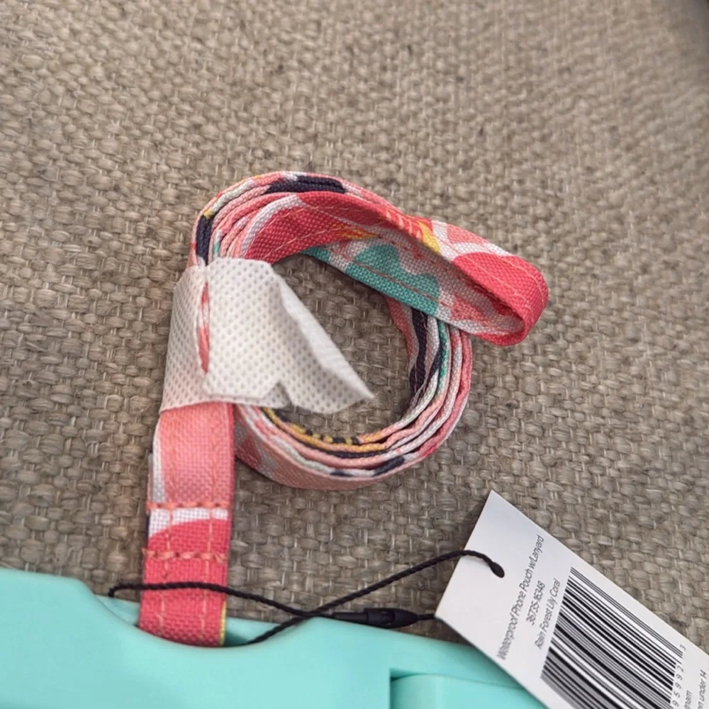 NEW. Vera Bradley Waterproof Phone Pouch with Lanyard. Rain Forest Lily Coral.